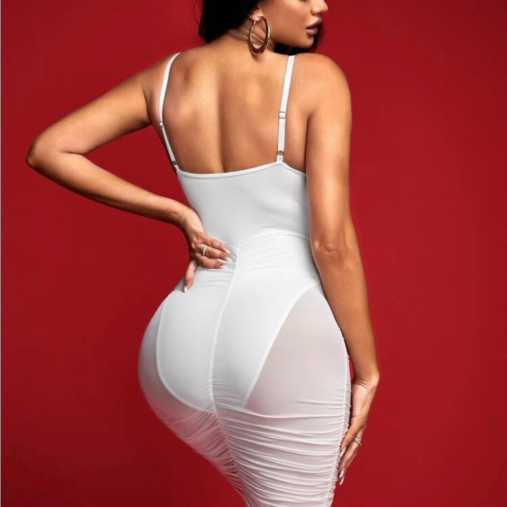 "Globetrotter glam: Rock this sexy white mesh dress on your adventures."
